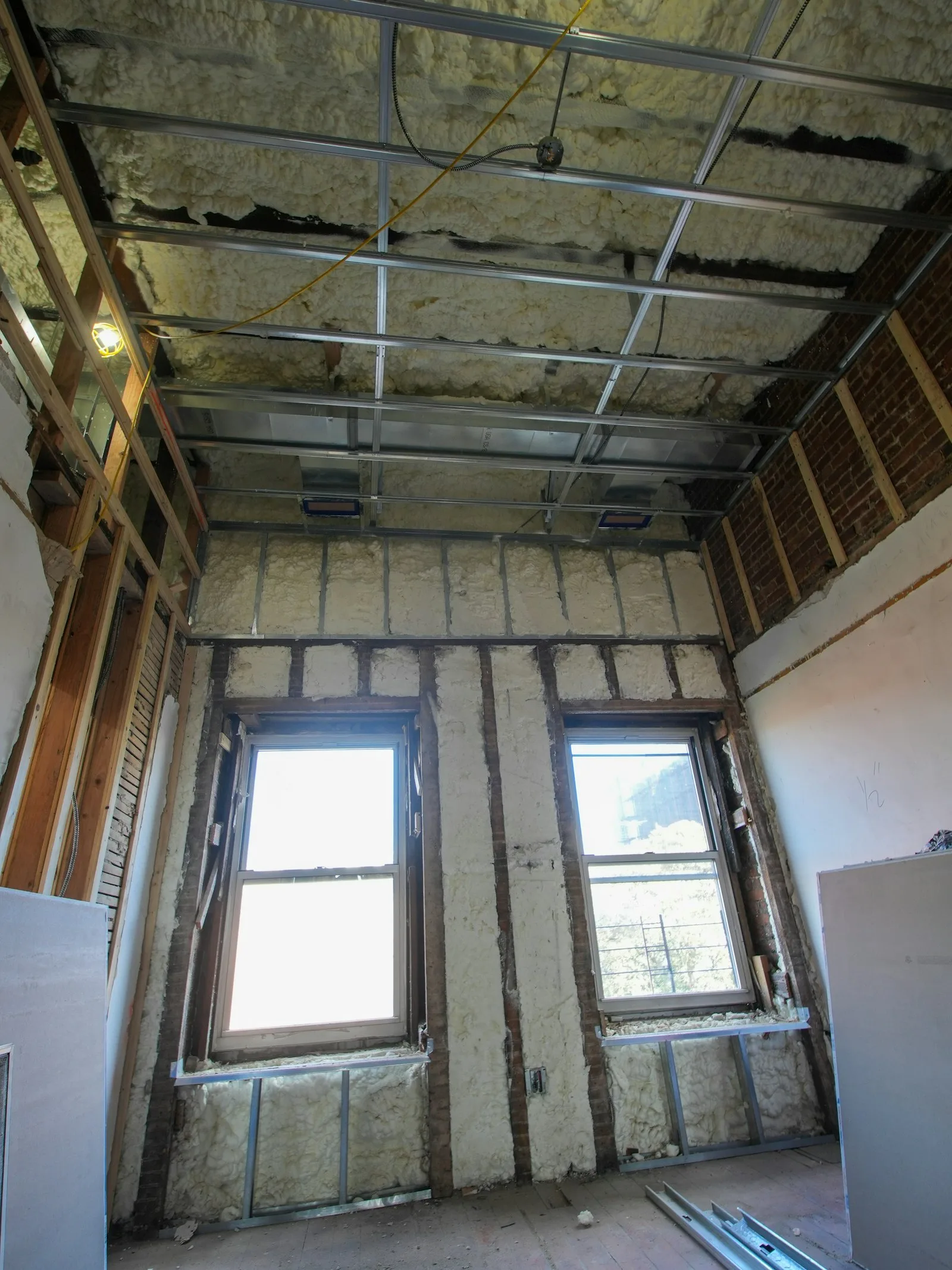 Attic interior with exposed framing and insulation in a Port St. Lucie home